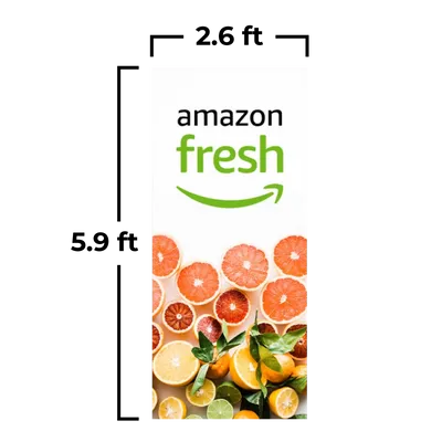 2.6 x 5.9 ft An advertising banner for 'Amazon Fresh' features a logo at the top and a vibrant selection of citrus fruit slices beneath it.