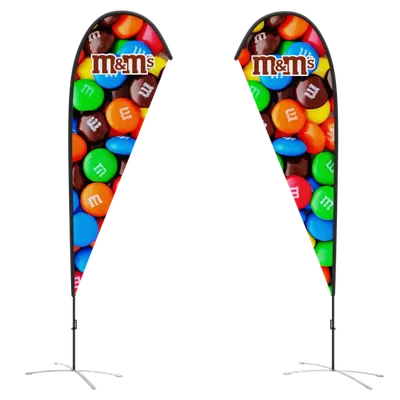 Both Sides Two vertical teardrop-shaped banners with a colorful M&M's design flank a set of steps, likely advertising the candy at an event or store display.