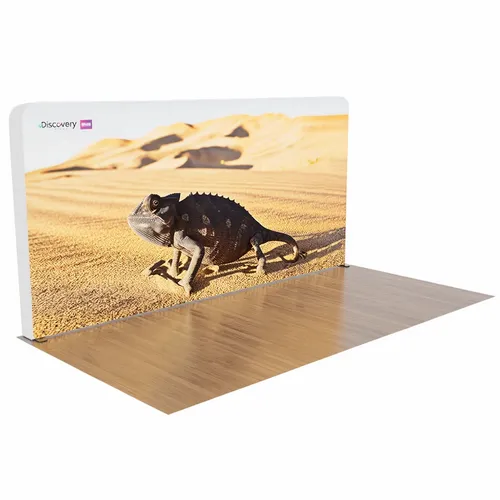 A trade show display features an image of a chameleon trekking across a desert, promoting 'Discovery.'